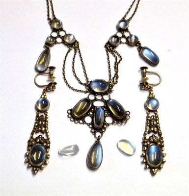 Lot 1130 - An Arts and Crafts Moonstone Necklace, cabochon moonstones in collet settings form three...