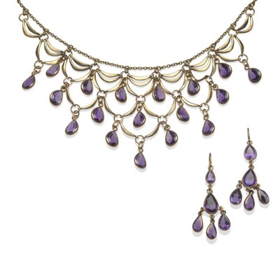 Lot 1144 - A 9 Carat Gold Amethyst Necklace, a chain suspends shaped links, and graduated layers of pear...