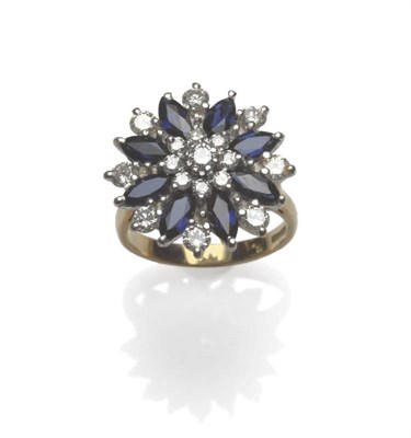 Lot 1153 - A 9 Carat Gold Sapphire and Diamond Cluster Ring, round brilliant cut diamonds and marquise cut...