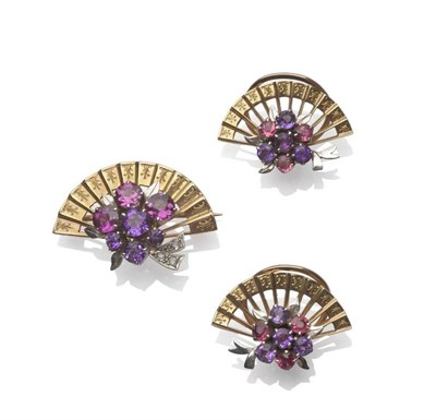 Lot 1167 - An Amethyst Brooch and Earring Set, each of a fan motif, with central clusters of varied hues...