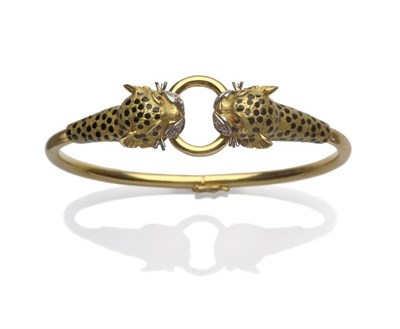 Lot 1173 - A Bangle, of double leopard head design, each holding one side of a loop in it's mouth, to a hinged