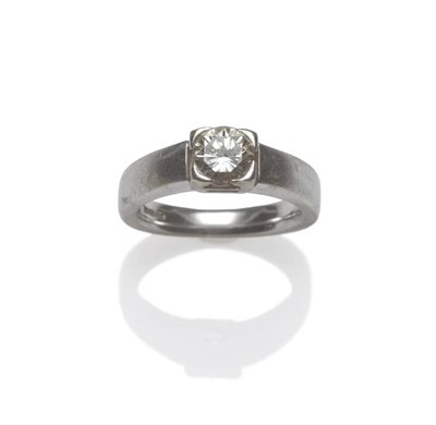 Lot 1181 - An 18 Carat White Gold Diamond Solitaire Ring, a round brilliant cut diamond in a white four...