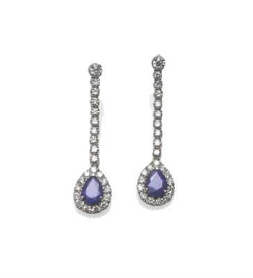 Lot 1182 - A Pair of 18 Carat White Gold Sapphire and Diamond Earrings, the string of round brilliant cut...