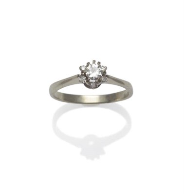 Lot 1184 - A Diamond Cluster Ring, a round brilliant cut diamond centrally within a border of single cut...