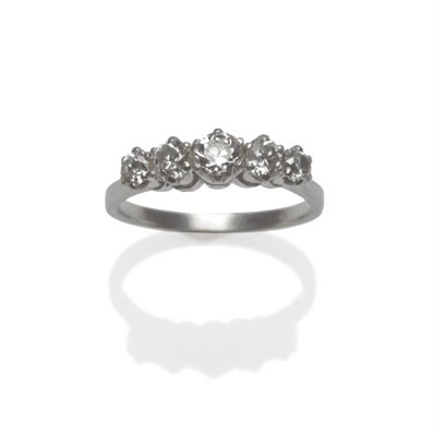 Lot 1189 - A Diamond Five Stone Ring, the graduated old cut diamonds in white claw settings, to a tapered...