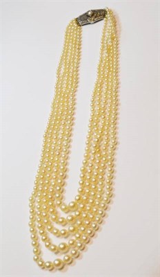 Lot 1194 - A Cultured Pearl Necklace, five rows of graduated cultured pearls, knotted to a plaque set with...