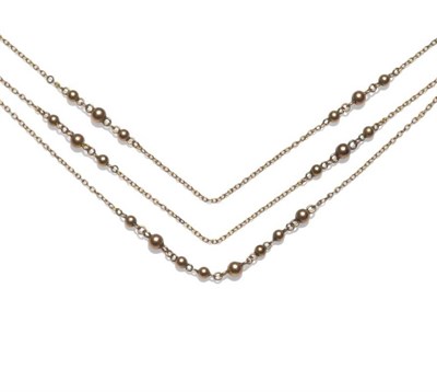 Lot 1201 - A Bead Necklace, three strands of chain links, with bead designs intersecting, length (of...