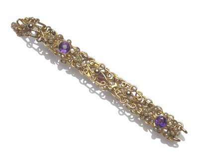 Lot 1202 - An Early 20th Century Bracelet, fancy entwined links spaced at intervals by openwork panels with an