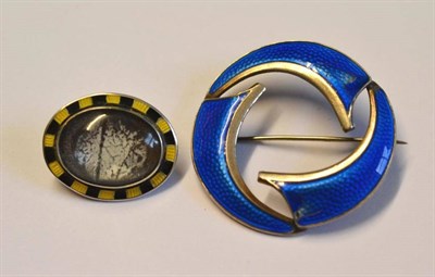 Lot 1210 - A Norwegian Enamel Brooch, by Bull, Jansen & Prydz, the stylised hoop enamelled in blue,...