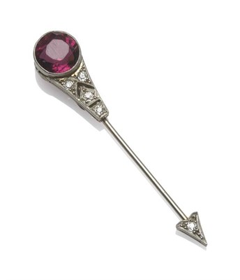 Lot 1242 - An Art Deco Garnet and Diamond Jabot Pin, the round mixed cut garnet to a tapered pierced...