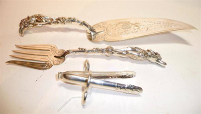 Lot 1247 - A Pair of Fine Continental Silver Plated Fish Servers, each handle cast in the form of a...