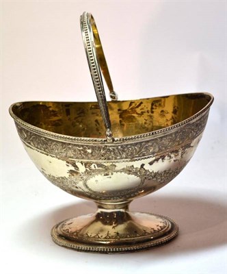 Lot 1307 - A George III Silver Sugar Basket, probably John Robins, London 1805, oval with swing handle and...