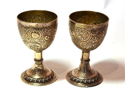 Lot 1322 - A Pair of George III Silver Goblets, maker's mark possibly IK, London 1772, with later embossed...