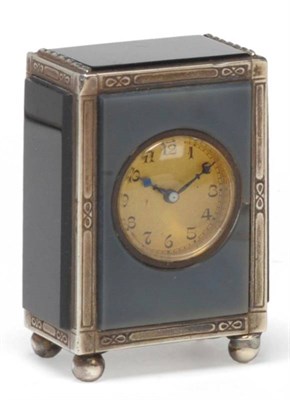 Lot 1339 - A George V Miniature Travelling Clock, 1924, case with hard stone panels, underside stamped...