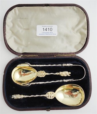 Lot 1410 - A Pair of Apostle Spoons with Matching Tongs, Henry Holland , London 1870, with silver gilt...