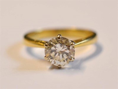 Lot 1209A - An 18 Carat Gold Diamond Solitaire Ring, the round brilliant cut diamond in a six claw white...