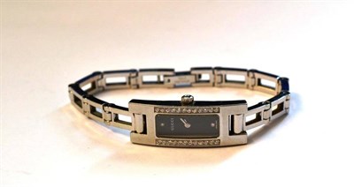 Lot 1017 - A Lady's Stainless Steel and Diamond Set Wristwatch, signed Gucci, circa 2004, quartz movement,...