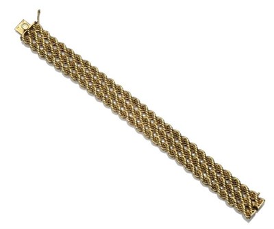 Lot 1021 - A Rope Twist Bracelet, three yellow rope twist links adjoin, length 19cm, width 1.6cm
