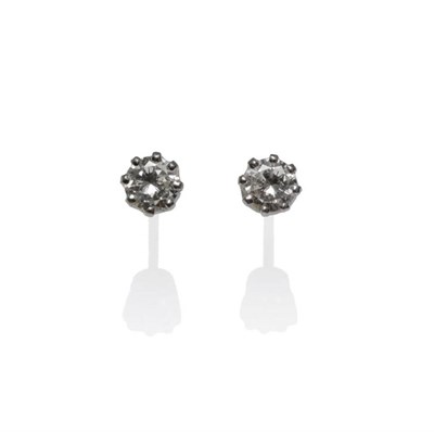 Lot 1022 - A Pair of Diamond Solitaire Stud Earrings, the round brilliant cut diamonds in white claw settings
