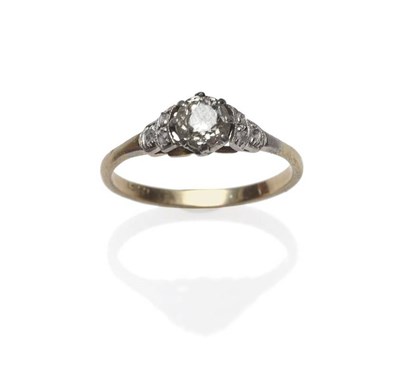 Lot 1042 - A Diamond Solitaire Ring, circa 1930, the old cut diamond in a white claw setting, flanked by...