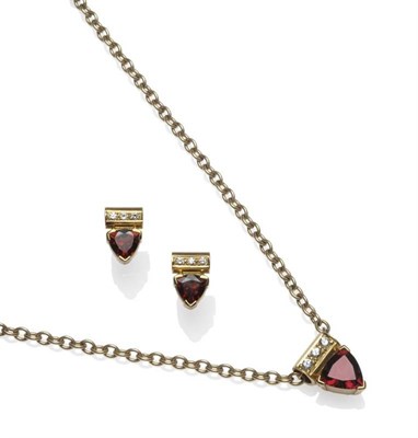 Lot 1060 - An 18 Carat Gold Garnet and White Stone Pendant on Chain, a trilliant cut garnet in a yellow...