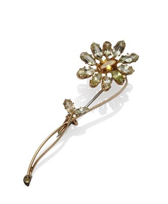 Lot 1062 - A French Flower Brooch, stamped 'JC', set with citrines in shades of orange, yellow and pale green
