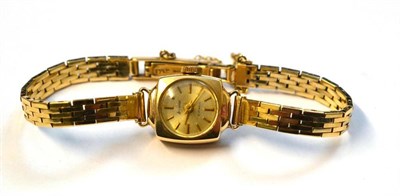 Lot 1074 - A Lady's 9ct Gold Wristwatch, signed Accurist, 1966, lever movement, silvered dial with applied...