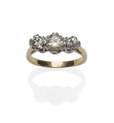 Lot 1088 - A Diamond Three Stone Ring, the graduated round brilliant cut diamonds in white settings, to a...