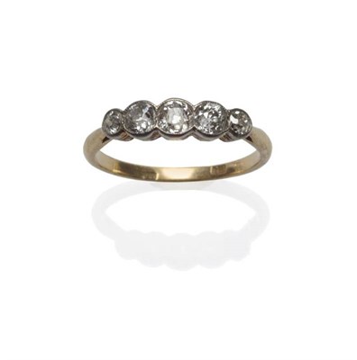Lot 1095 - An Early 20th Century Diamond Five Stone Ring, the graduated old cut diamonds in white...