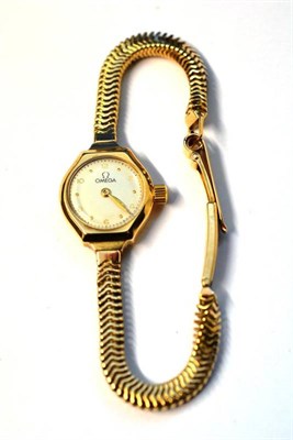 Lot 1103 - A Lady's 9ct Gold Wristwatch, signed Omega, 1949, lever movement, silvered dial with dot and Arabic