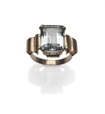 Lot 1110 - An Aquamarine Ring, circa 1940, the emerald-cut aquamarine in a rose coloured four claw setting, to