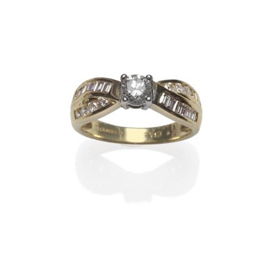 Lot 1116 - An 18 Carat Gold Diamond Ring, a round brilliant cut diamond in a white four claw setting, to twist