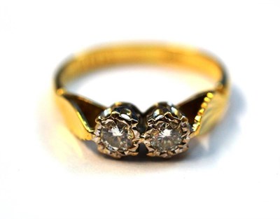 Lot 1124 - A Diamond Two Stone Ring, the round brilliant cut diamonds in white illusion settings to yellow...