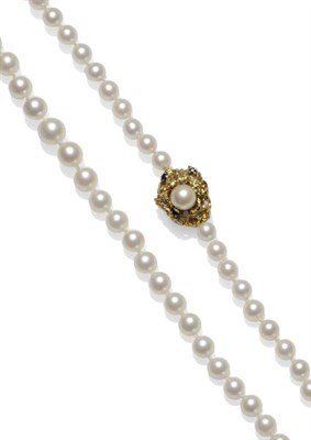 Lot 1139 - A Cultured Pearl Necklace, sixty-one graduated cultured pearls knotted to an asymmetric...