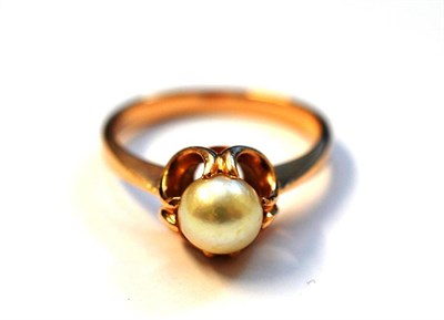 Lot 1141 - A Cultured Pearl Ring, a cultured pearl in a rose claw setting on a tapered shoulder plain polished