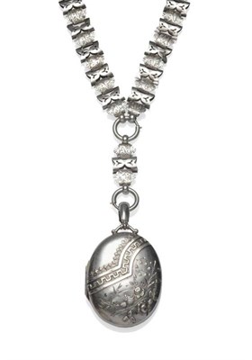 Lot 1144 - A Victorian Silver Locket on Necklace, the oval locket with border and floral decoration, on an...