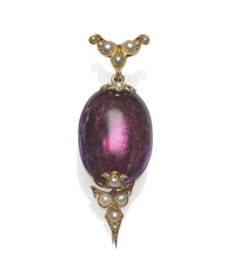 Lot 1145 - An Amethyst and Split Pearl Pin, the large foil backed cabochon amethyst with mounts to each...