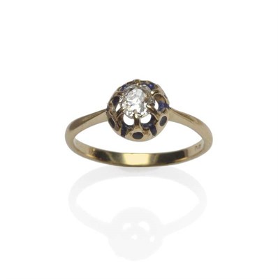 Lot 1146 - A Diamond Solitaire Ring, the old cut diamond in a yellow claw setting with blue enamel detail,...