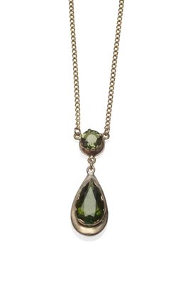 Lot 1165 - A Green Tourmaline and A Green Sapphire Drop Necklace, the round cut green sapphire in a yellow...