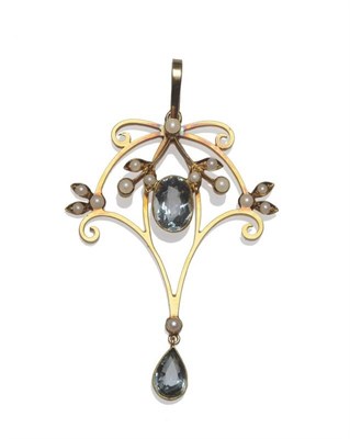 Lot 1170 - An Art Nouveau Aquamarine and Seed Pearl Pendant, of typical scrolling openwork form, measures...