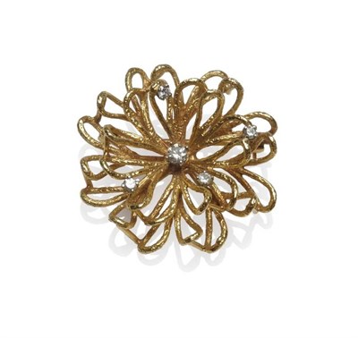 Lot 1180 - A Diamond Set Brooch, circa 1960, textured yellow loops create a stylised floral form, set with...