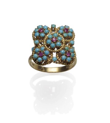 Lot 1181 - A Ruby and Turquoise Set Ring, of floral clusters within ropework borders, in yellow claw...