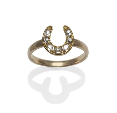 Lot 1203 - A Diamond Set Horseshoe Ring, the horseshoe inset with graduated old cut diamonds, on a yellow...