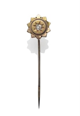 Lot 1208 - A Victorian Diamond Set Stick Pin, an old cut diamond within a star shaped frame, estimated diamond