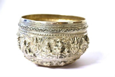 Lot 1222 - A Burmese or Indian Silvered Metal Bowl, circular, embossed with figures, the signs of the...