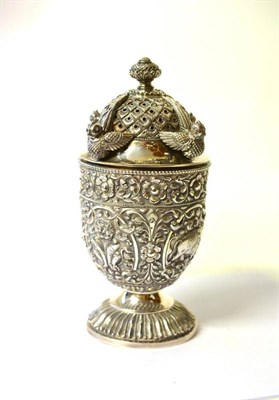 Lot 1228 - An Indian Silvered Metal Sugar Castor, early 20th century, the pierced screw off lid mounted...