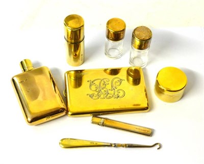 Lot 1245 - Eight Edwardian Silver Gilt Dressing Case Fittings, Charles and George Asprey, London various...