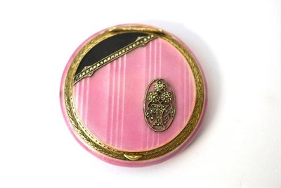 Lot 1294 - An Art Deco Silver Gilt and Pink Guilloché Enamel Compact, stamped 925, circular, the hinged...