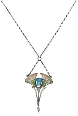 Lot 1002 - An Art Nouveau Plique-à-Jour Pendant, the drop form with a synthetic blue stone centrally, and...