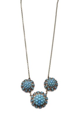 Lot 1004 - A Turquoise Necklace, three bombé turquoise clusters chain linked, and on a fine trace link chain